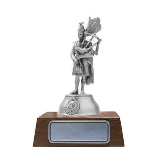 Argyll & Sutherland Highlanders Piper figurine by Buckingham Pewter on a wooden base, showcasing detailed craftsmanship.